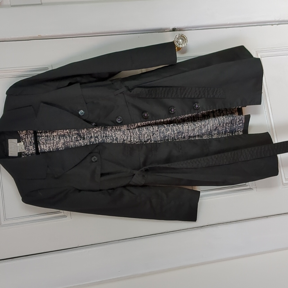 Classic black trench with waist band and flared bottom